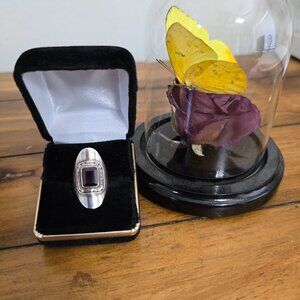 Beautiful Sterling Silver and garnet ring. Fits like 4.5. Includes 925 mark.